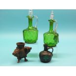 A pair of Victorian green glass decanters, each with clear glass stopper, 9.75in., together with