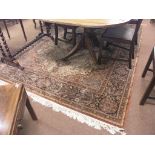 A Belgian wool rug, Eastern foliate design with central cream field, 10ft. x 7ft.