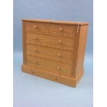 A solid, waxed pine chest, two short and three long drawers, turned wood knob handles, 3ft. 6in.