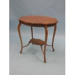 A late Victorian inlaid mahogany occasional table, lobed, oval form with braced undertier, 2ft.