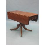 An early 19th century mahogany drop-leaf table, with single, oak-lined frieze drawer, on pedestal