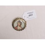 A gilded white metal brooch, with inset painted portrait bust, young female signed Villaume, 2in.