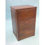 An Eastern hardwood chest, hinged top above three fall-front doors, 1ft. 10in. - lower drawer