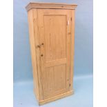 A Victorian stripped pine wardrobe, enclosed by single, panelled door, 2ft. 8in. wide