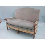 An oak-framed two-seater settee, upholstered in a pale blue dralon, and matching armchair