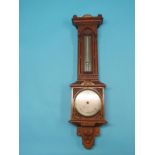 A Victorian oak Gothic Revival barometer by Negretti & Zambra, London, No. 6706, featuring