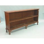 A Victorian-style mahogany open bookcase, with gadrooned mouldings, on claw and ball feet, 5ft. 8in.