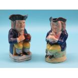 A Wood-type Toby jug, character wearing blue coat and yellow breeches, 9.5in., and another, similar