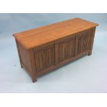 A reproduction dark oak coffer, with linenfold panelled front, 3ft. 8in. - clean