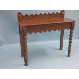 An unusual Victorian oak hall set, side table, 3ft. 5in., and a pair of single chairs carved with