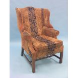 A Chippendale-style mahogany wing armchair, upholstered in a multi-coloured stamped dralon, arm