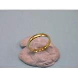 A 22ct. gold band wedding ring, approx. 4.7 grams, size P