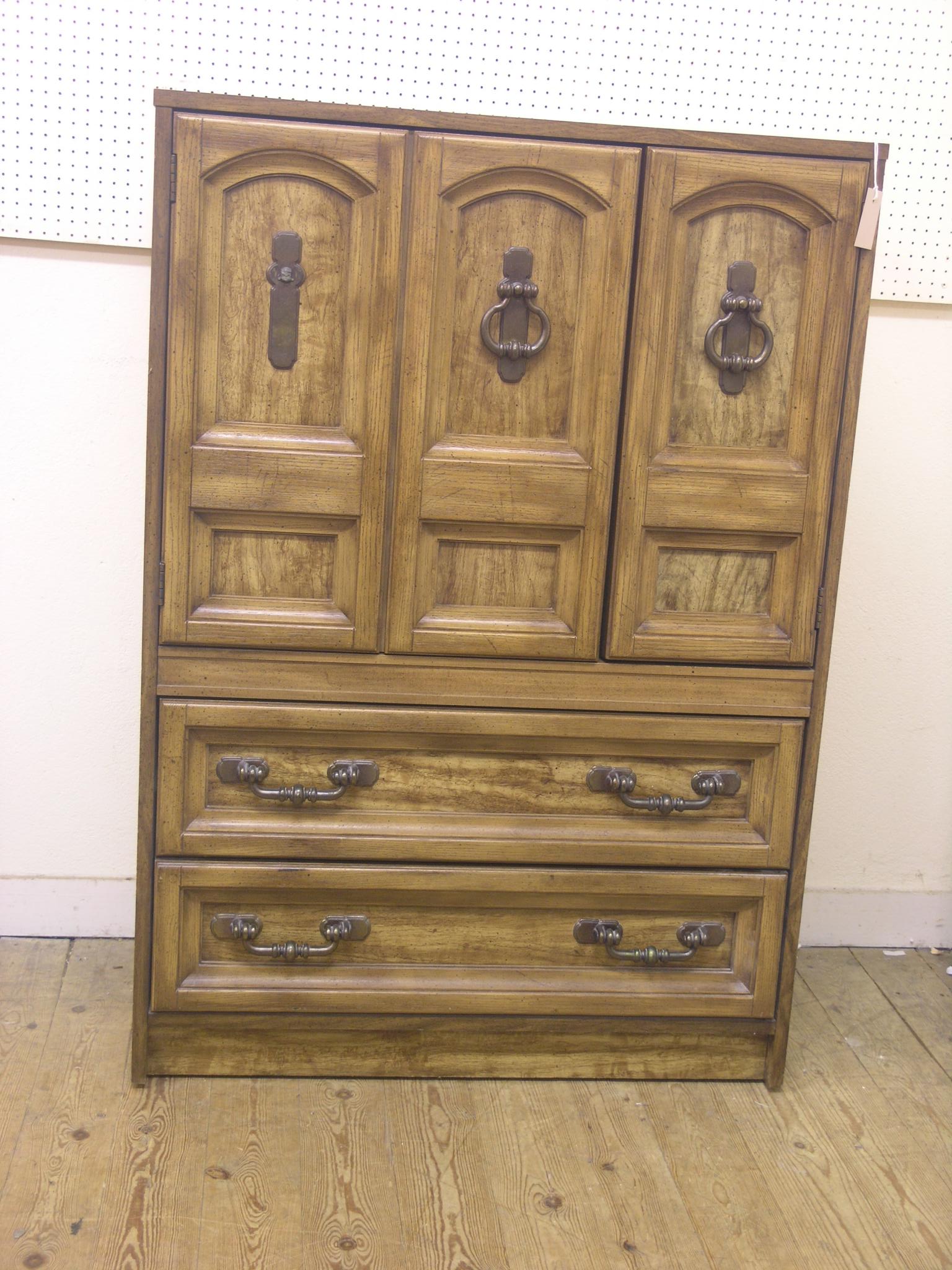 An Armstrong bedroom cupboard, woodgrain-effect with two base drawers, 2ft. 11in., and a period-