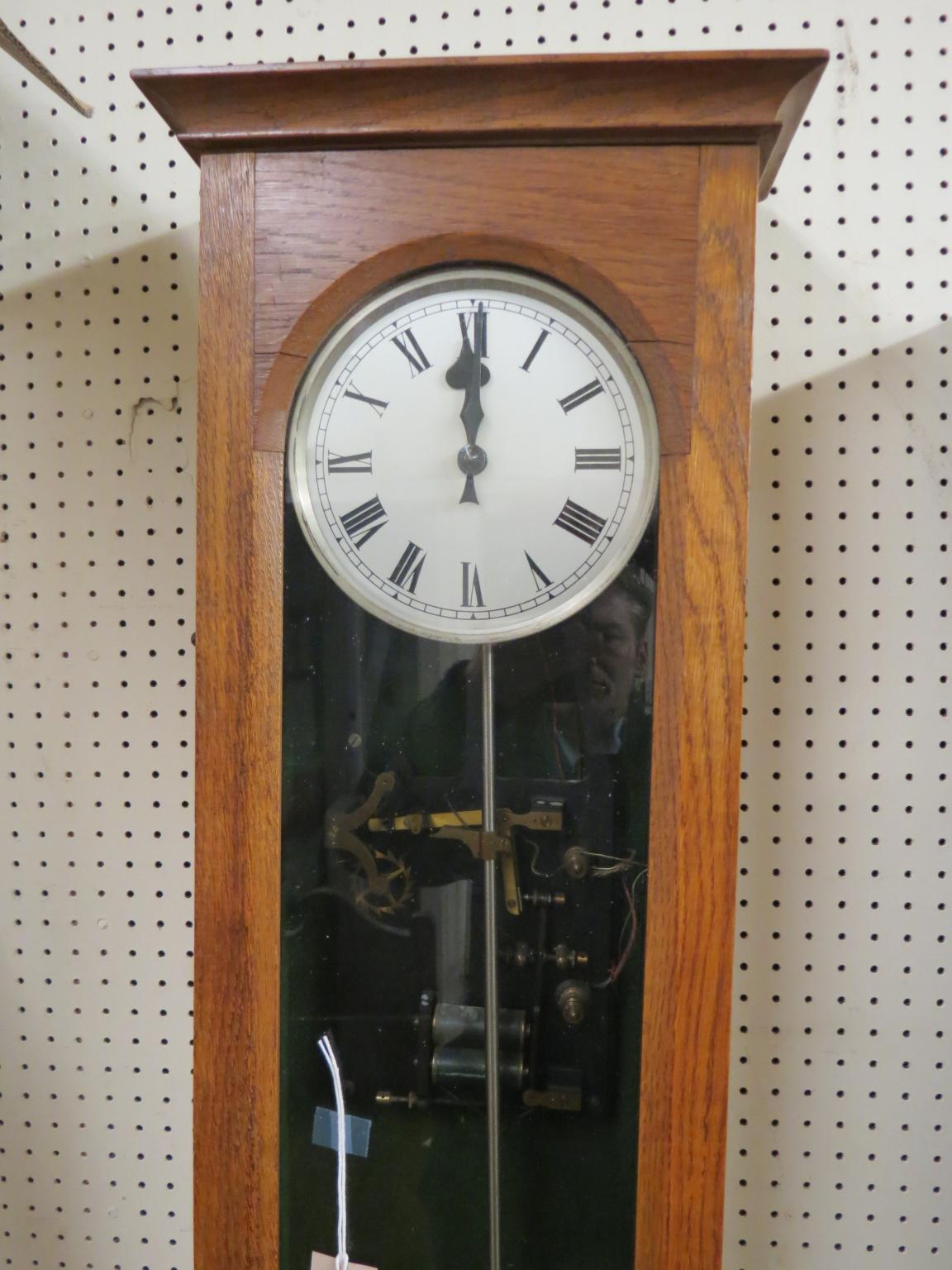 An early electric timepiece, with silvered dial and single glazed trunk door, with pendulum and - Image 2 of 4