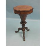 A Victorian walnut work table, octagonal inlaid top enclosing lined fittings, on carved tripod base