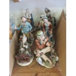 Eight various Capo Di Monte-style figures, including seated tramp with mouth-organ, tallest 10.5in.