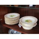 A Victorian bone china botanical dessert set, two comports and eleven plates, brightly enamelled