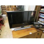 A Samsung flatscreen television, LT28E310, 28in. screen, with remote control