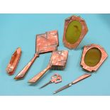 An Art Deco dressing table set, seven pieces including hand-mirror and a pair of photograph