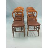 A set of six Victorian balloon-back dining chairs, with vinyl seats and front turned legs, some