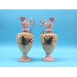 A pair of late Victorian earthenware ewers, brightly painted with birds in flight, 17in.