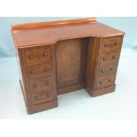 A late Victorian mahogany kneehole desk, four short drawers to each side, turned wood knob