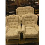 A modern three-piece suite, two-seater wing settee and pair of wing armchairs, buttoned cream and