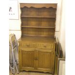 A medium oak linenfold dresser, with twin-shelf plate rack, 3ft. 1in.