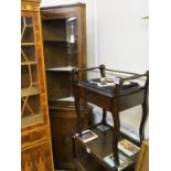 A dark oak corner cabinet, with panelled cupboard base, 6ft. 2in., a carved, dark oak trolley and an