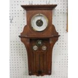 A late Victorian aneroid barometer, oak case inlaid with a Glasgow-type design including abalone and