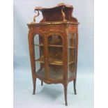 A Louis XV-style kingwood and parquetry display cabinet, eleaborate ormolu mounts throughout,