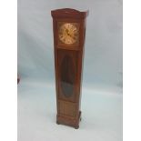 A mahogany longcase clock, traditional square brass dial and Black Forest chiming movement, with