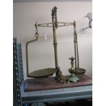 A Victorian brass weighing scale, to weigh 3lbs., mahogany plinth with five brass weights,
