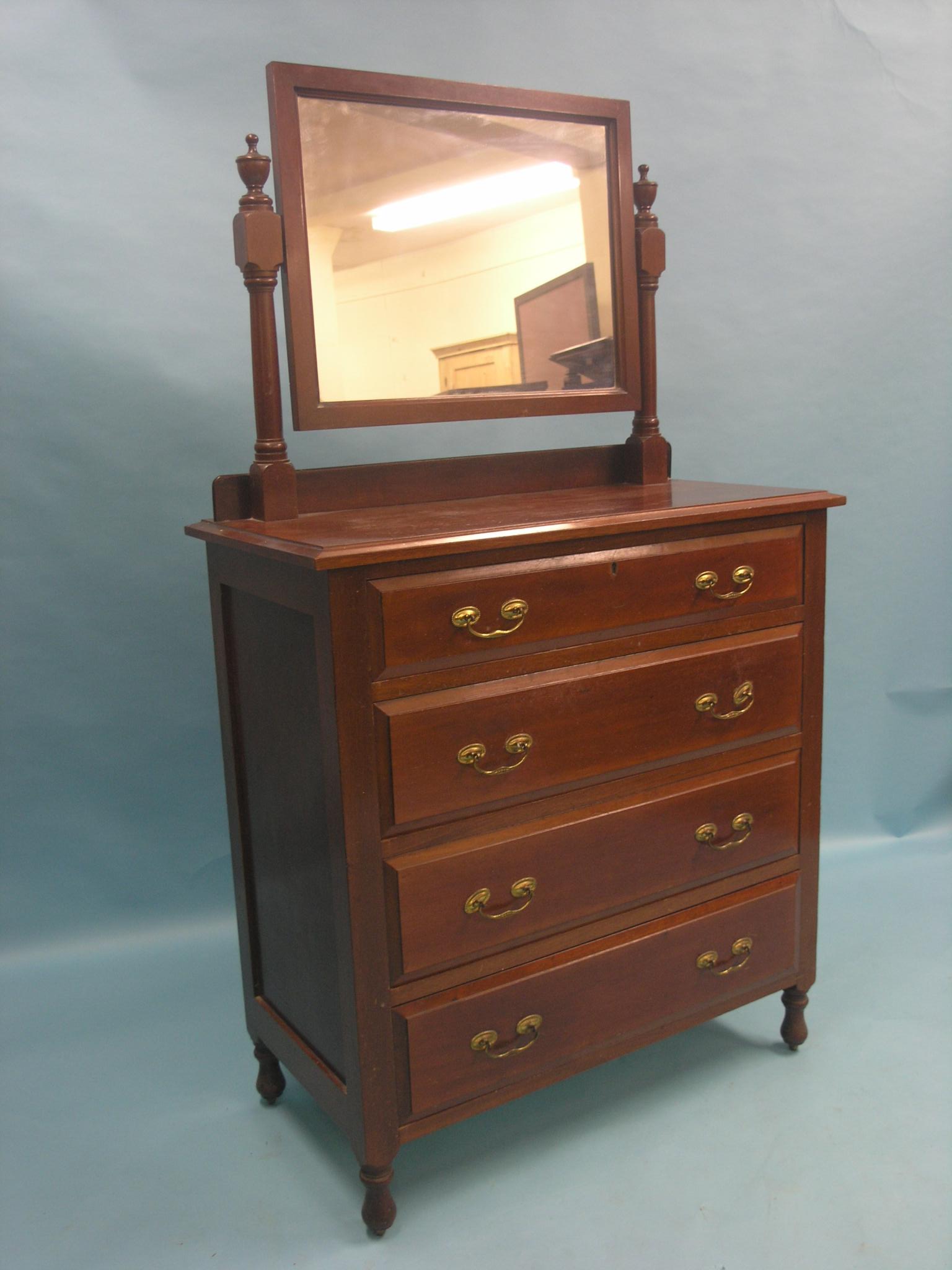 A late Victorian mahogany dressing chest, adjustable mirror above four long oak-lined drawers, brass