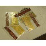 Seven USA 24ct. gold banknotes, contained within packets, as certified