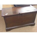 An 18th century colonial teak trunk, boarded construction with cast iron carrying handles,