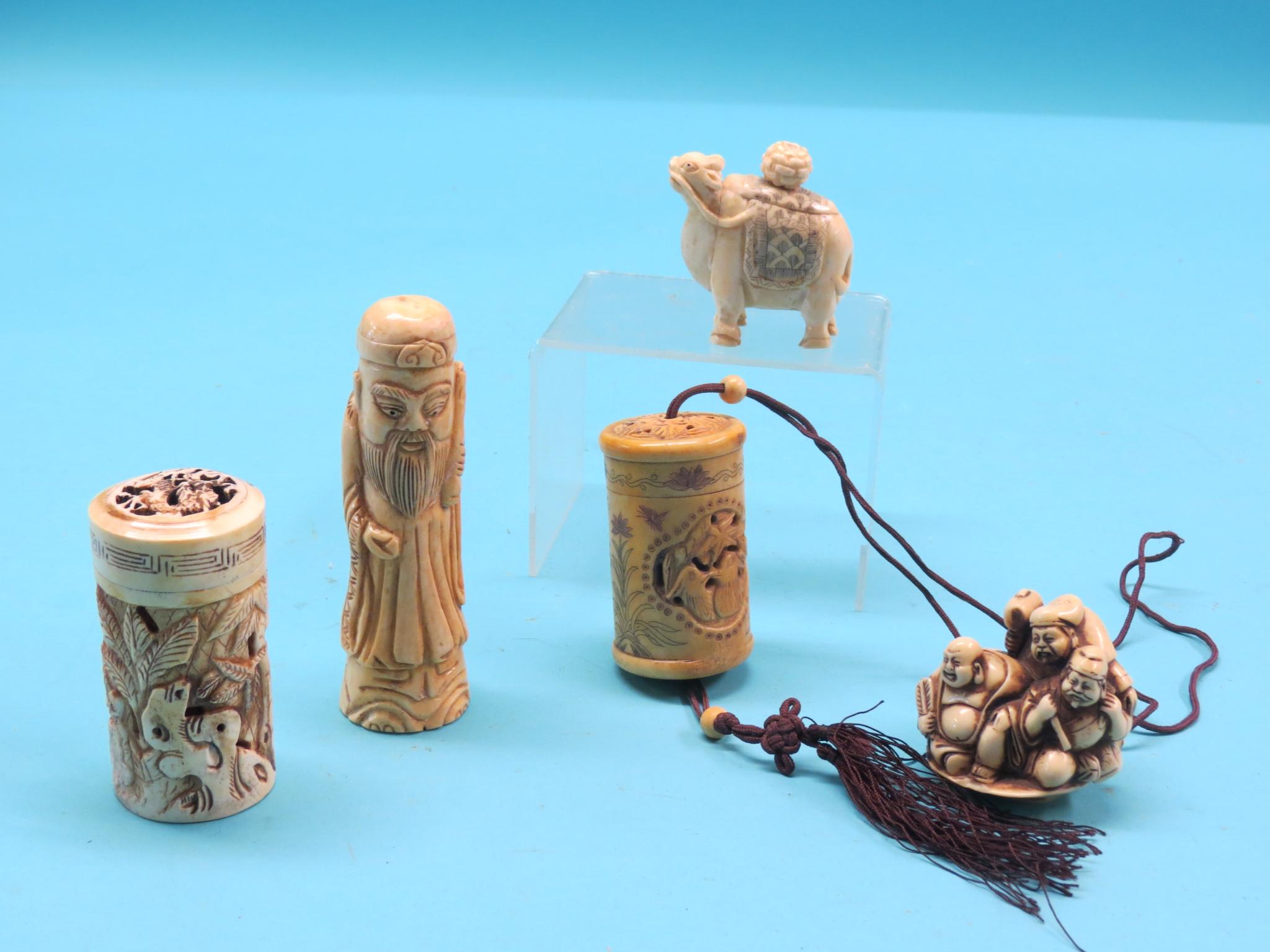 Four carved bone items, including wild animal scent bottle with stopper and two cylindrical bottles,