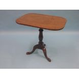 An early 19th century mahogany tripod table, rectangular top tilting on baluster stem, top 2ft. 5in.