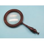 A Victorian turned rosewood magnifying lens, with moulded and turned detail, 11.5in. high