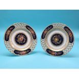 A pair of Victorian bone china cabinet plates, finely-enamelled with fruit and leafage, blue and