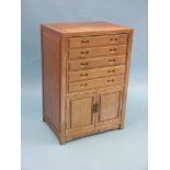 An Eastern hardwood cutlery cabinet, five baize-lined drawers above panelled cupboard, 1ft.