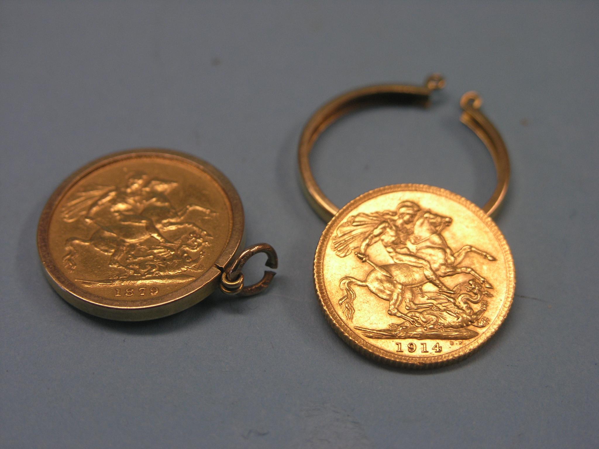 Two gold sovereigns, 1879, 1914, each within 9ct. gold mount