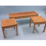 An Eastern hardwood coffee table, 3ft. 8in., and a set of four matching square wine tables, 1ft.