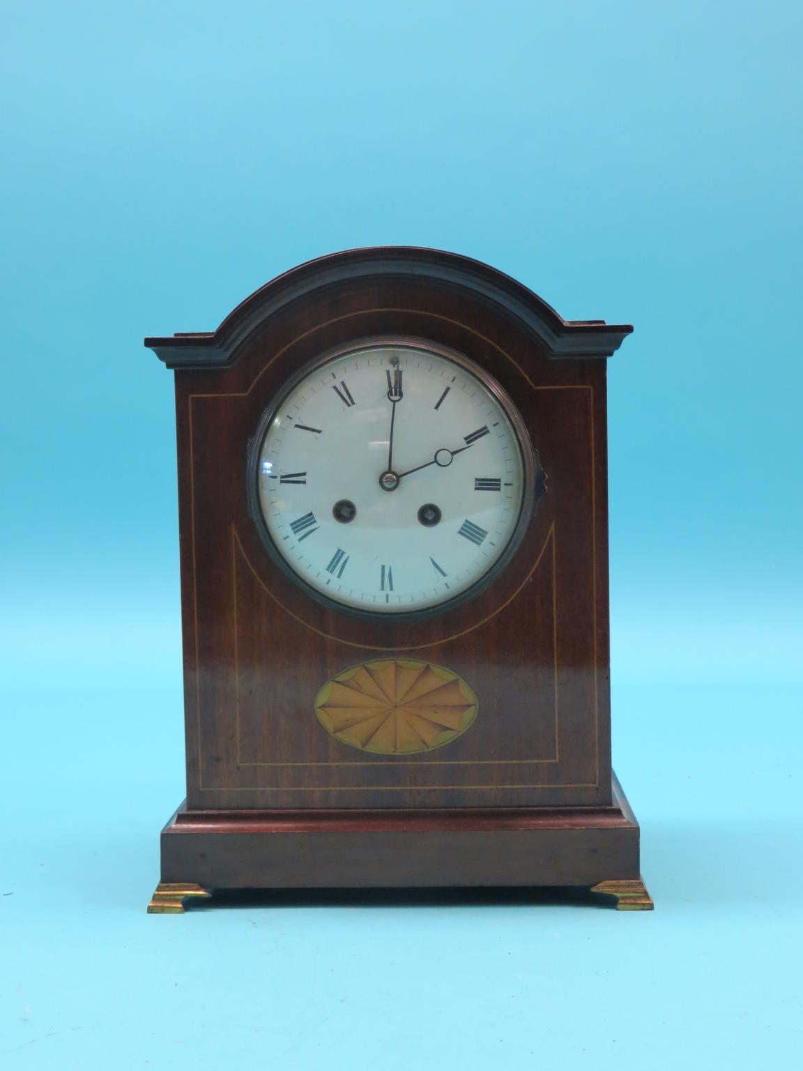 An Edwardian inlaid mahogany mantel clock, with convex enamelled dial and French Mougin gong-