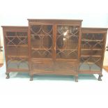 An early 20th century break-fronted mahogany bookcase, arrangement of adjustable shelves enclosed by