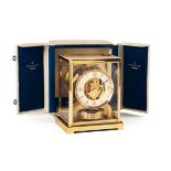 JAEGER-LECOULTRE, ATMOS "EMBASSY ROUGE", REF 5904. A fine brass and glass Atmos clock [...]