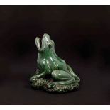 A green-glazed pottery figure of frog, China, 20th century - h cm 21 - Start price : [...]