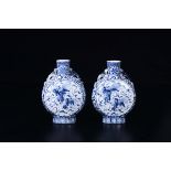 A pair of blue and white flasks with Pho dogs, China, 20th century - h cm 25,5 - [...]