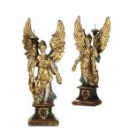 A pair of candleholder angels in polychrome and gilded papier-mâché. Italian [...]