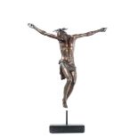 A dead Christ in molten, chiselled and patinated bronze. Halo in embossed silver. [...]